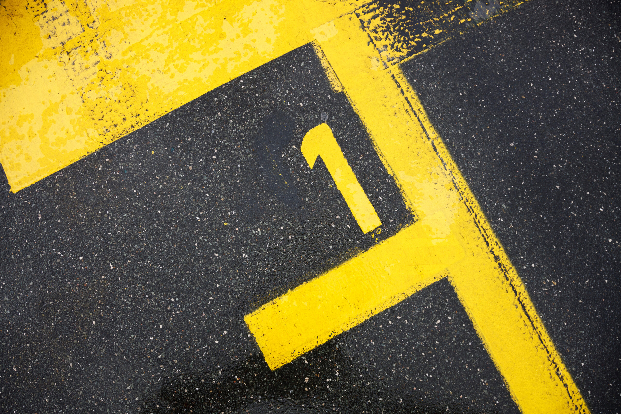 Number one sign on the road, motor race sign on the asphalt, the best pole position, review for the top